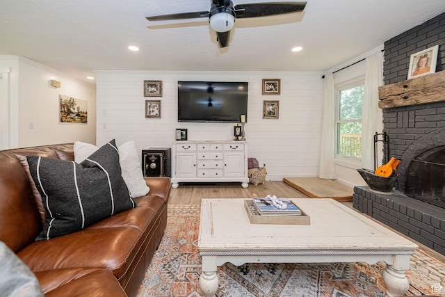 2127 E 5950 N, Liberty, UT 84310 - living area featuring light wood-type flooring, ornamental molding, a brick fireplace, and a ceiling fan