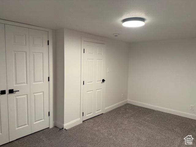 1456 E 5935 S, Murray, UT 84121 - unfurnished bedroom featuring dark colored carpet and a closet