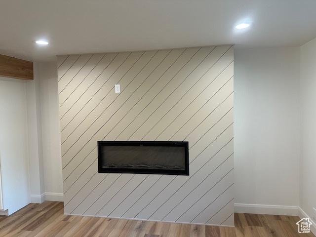 1456 E 5935 S, Murray, UT 84121 - detailed view of a large fireplace, wood finished floors, and recessed lighting