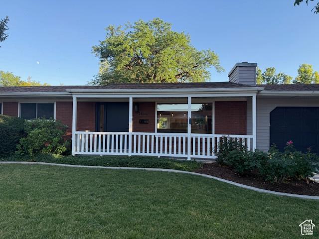 1456 E 5935 S, Murray, UT 84121 - single story home featuring a front yard, a chimney, and covered porch