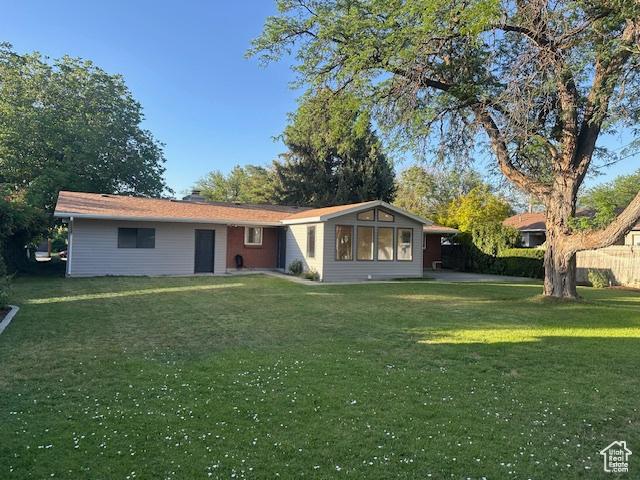 1456 E 5935 S, Murray, UT 84121 - back of property featuring a lawn