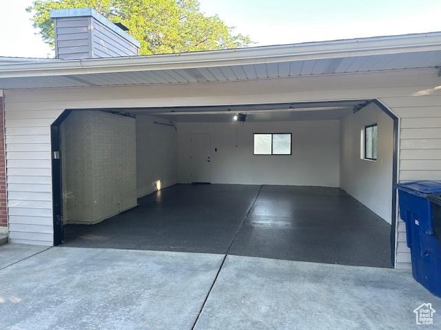 1456 E 5935 S, Murray, UT 84121 - garage featuring concrete driveway and a garage door opener