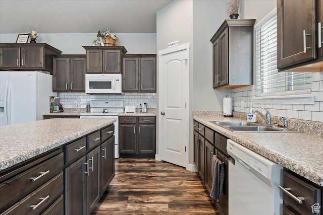 6533 W Elena St S, West Valley City, UT 84128 - kitchen featuring white appliances, dark wood-type flooring, dark brown cabinetry, light countertops, and backsplash