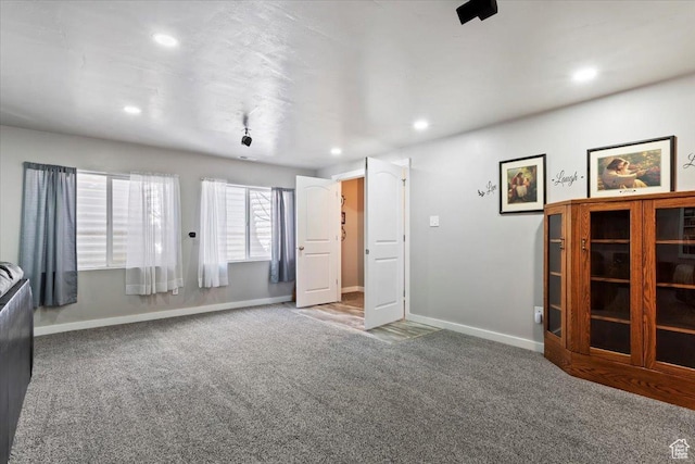 6533 W Elena St S, West Valley City, UT 84128 - unfurnished living room featuring carpet and recessed lighting