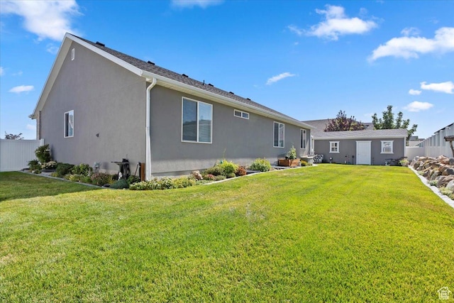 6533 W Elena St S, West Valley City, UT 84128 - rear view of house featuring stucco siding