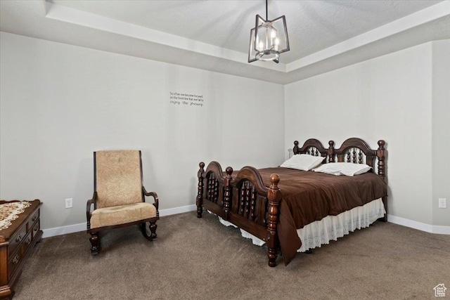 6533 W Elena St S, West Valley City, UT 84128 - carpeted bedroom featuring a tray ceiling and a chandelier