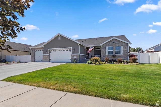 6533 W Elena St S, West Valley City, UT 84128 - view of front of property featuring a garage, driveway, stucco siding, and stone siding