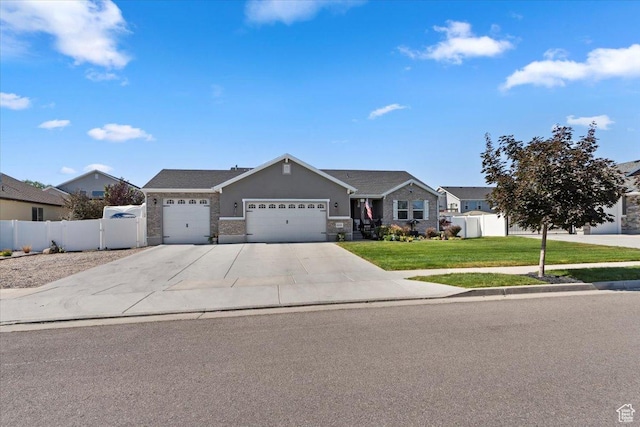 6533 W Elena St S, West Valley City, UT 84128 - ranch-style house featuring a garage and driveway