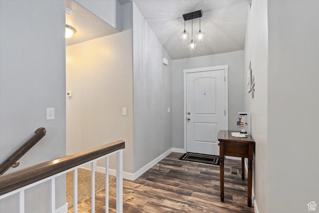 6533 W Elena St S, West Valley City, UT 84128 - foyer entrance featuring wood finished floors and baseboards