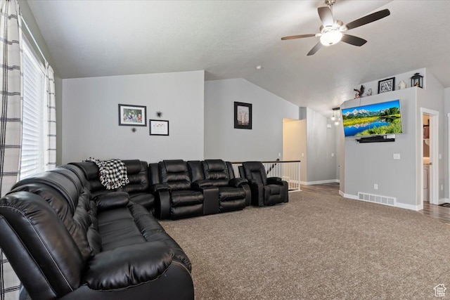 6533 W Elena St S, West Valley City, UT 84128 - living area with vaulted ceiling, a ceiling fan, and carpet flooring