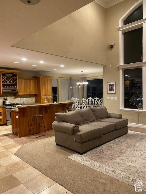9061 N Canyon Dr, Cedar Hills, UT 84062 - living area featuring recessed lighting, a chandelier, and ornamental molding
