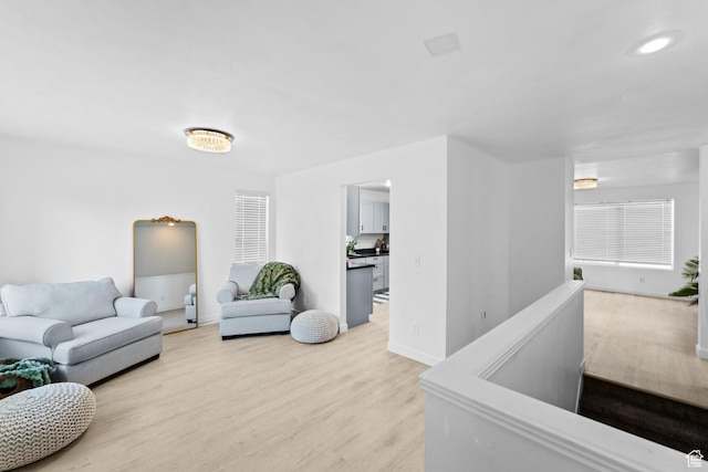 25 E 1860 N, Tooele, UT 84074 - living room with light wood-style flooring and baseboards