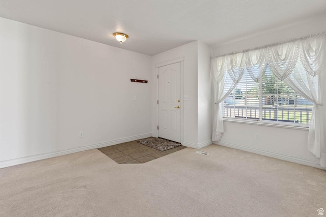 2474 N Dorchester Ave, Harrisville, UT 84414 - foyer entrance with carpet floors and baseboards