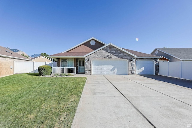 2474 N Dorchester Ave, Harrisville, UT 84414 - ranch-style house with a garage, covered porch, and concrete driveway