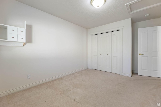 2474 N Dorchester Ave, Harrisville, UT 84414 - unfurnished bedroom with carpet, a closet, and a textured ceiling