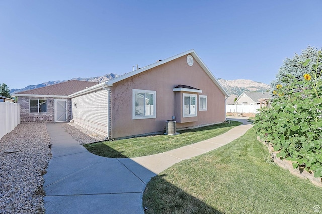 2474 N Dorchester Ave, Harrisville, UT 84414 - view of side of home featuring a mountain view and brick siding