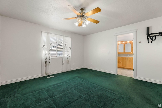 2474 N Dorchester Ave, Harrisville, UT 84414 - empty room with carpet floors, a ceiling fan, and a textured ceiling