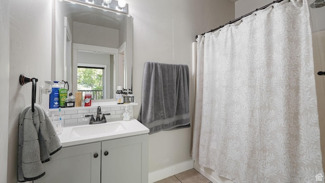 8457 S Ivy Springs Ln W, West Jordan, UT 84081 - bathroom with vanity, tile patterned flooring, tasteful backsplash, and curtained shower