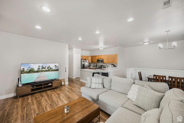 8457 S Ivy Springs Ln W, West Jordan, UT 84081 - living area featuring a chandelier, light wood finished floors, and recessed lighting