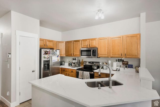 8457 S Ivy Springs Ln W, West Jordan, UT 84081 - kitchen featuring stainless steel appliances, a peninsula, and light stone countertops
