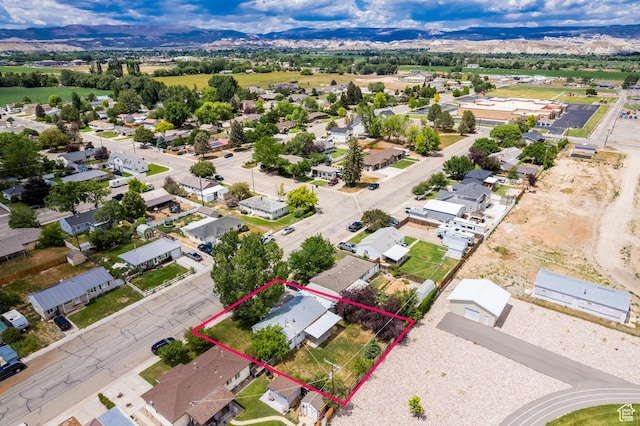 70 N 1100 W, Vernal, UT 84078 - aerial perspective of suburban area with property boundaries highlighted and a mountain backdrop