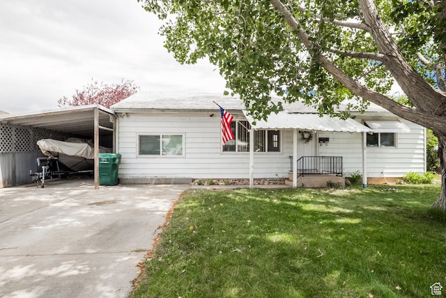 70 N 1100 W, Vernal, UT 84078 - view of front facade featuring a front lawn, driveway, and an attached carport