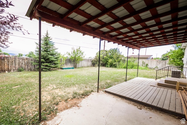 70 N 1100 W, Vernal, UT 84078 - fenced backyard featuring a wooden deck and a patio area
