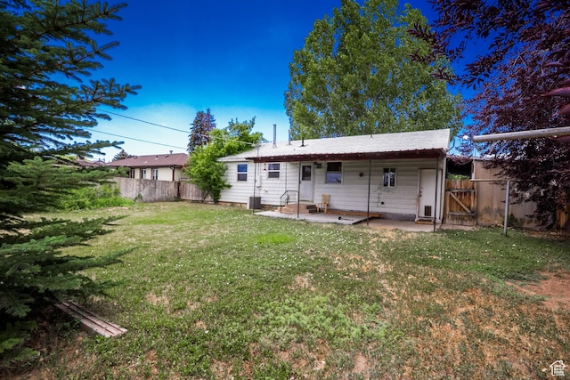 70 N 1100 W, Vernal, UT 84078 - rear view of property featuring a patio area and a gate