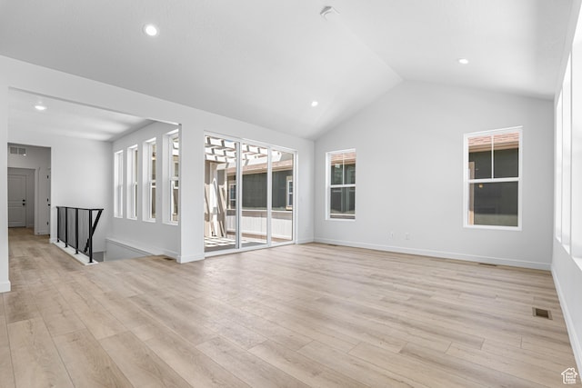 11184 S Easy Bee Rd Unit 265, South Jordan, UT 84009 - unfurnished living room featuring light wood-type flooring, lofted ceiling, and recessed lighting