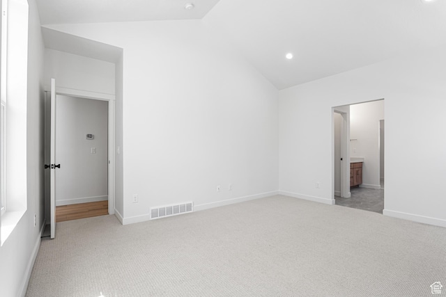 11184 S Easy Bee Rd Unit 265, South Jordan, UT 84009 - unfurnished bedroom with vaulted ceiling, light colored carpet, ensuite bathroom, and recessed lighting