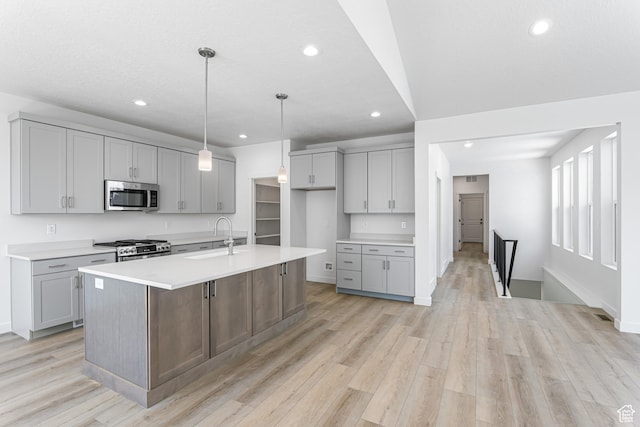 11184 S Easy Bee Rd Unit 265, South Jordan, UT 84009 - kitchen with appliances with stainless steel finishes, gray cabinets, recessed lighting, light wood-type flooring, and light countertops