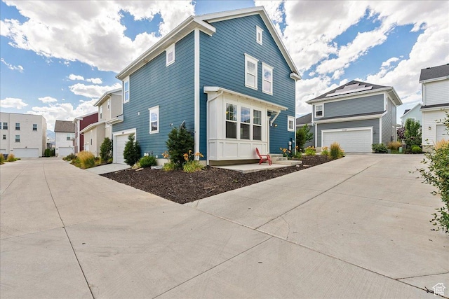 5239 W Mellow Way S, Jordan, UT 84009 - view of front facade featuring concrete driveway, a garage, and a residential view