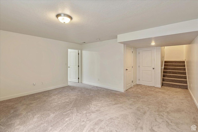 5239 W Mellow Way S, Jordan, UT 84009 - empty room with light carpet, stairway, and a textured ceiling