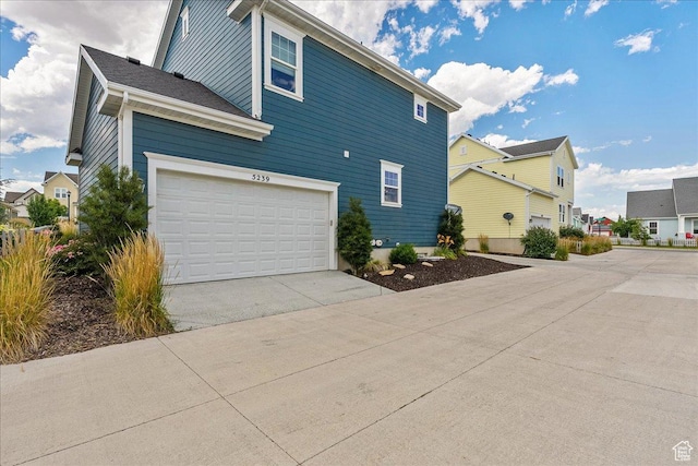 5239 W Mellow Way S, Jordan, UT 84009 - view of property exterior featuring concrete driveway and a residential view