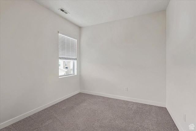 5239 W Mellow Way S, Jordan, UT 84009 - unfurnished room with carpet floors and a textured ceiling