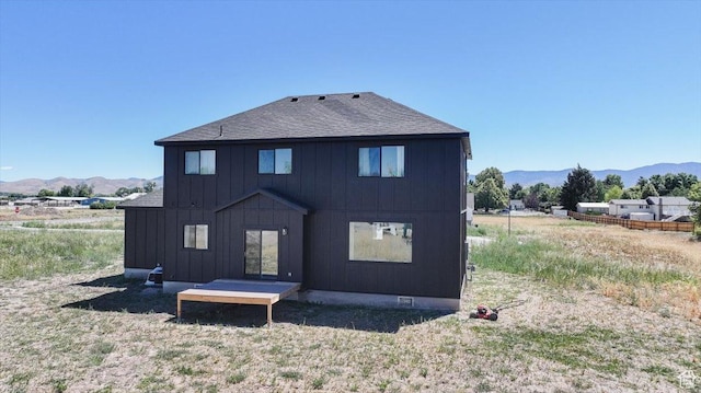 165 N 300 W, Preston, ID 83263 - rear view of property featuring a mountain view, board and batten siding, and roof with shingles