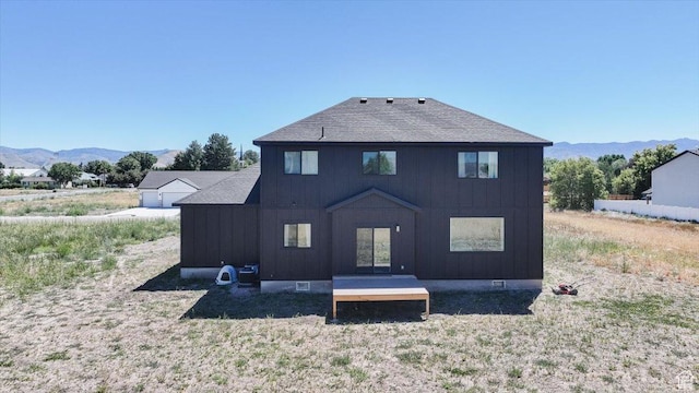 165 N 300 W, Preston, ID 83263 - rear view of property with a mountain view, a shingled roof, and board and batten siding