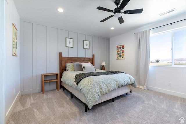 165 N 300 W, Preston, ID 83263 - bedroom with light colored carpet, recessed lighting, a decorative wall, and a ceiling fan