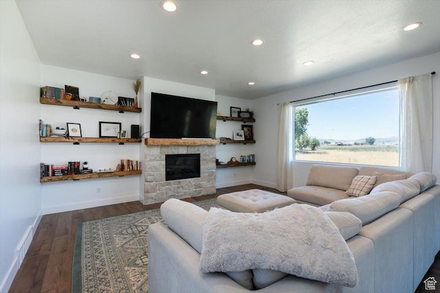 165 N 300 W, Preston, ID 83263 - living area featuring dark wood-type flooring, recessed lighting, and a stone fireplace