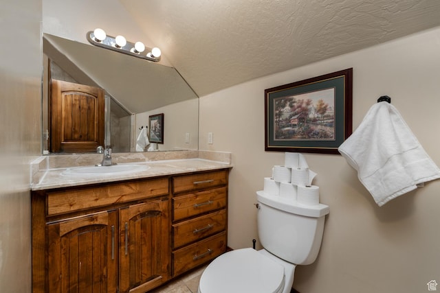 2849 W 1800 S, Vernal, UT 84078 - bathroom with vanity, lofted ceiling, a textured ceiling, and tile patterned flooring