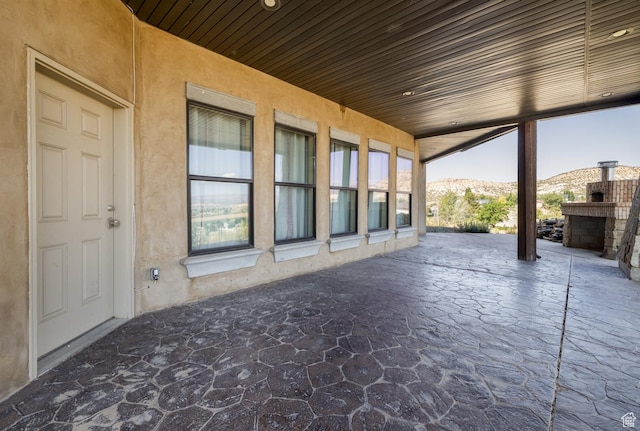 2849 W 1800 S, Vernal, UT 84078 - view of patio featuring a mountain view and exterior fireplace
