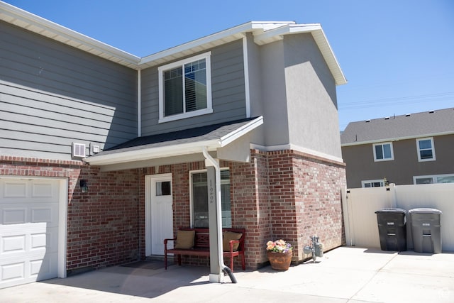 122 N 1325 W, Springville, UT 84663 - view of front of home with brick siding, a garage, and stucco siding