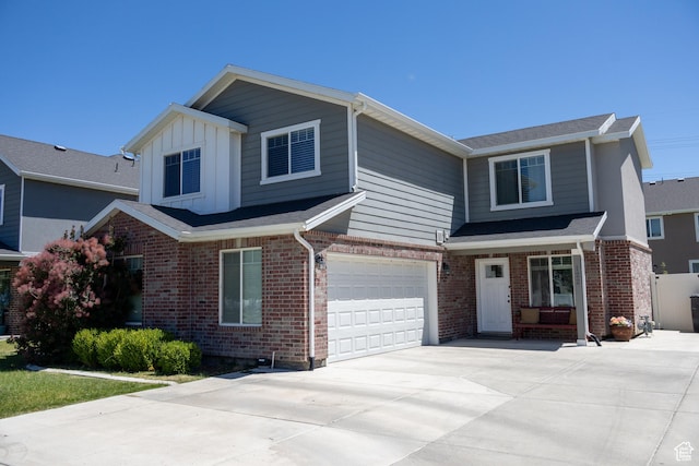 122 N 1325 W, Springville, UT 84663 - view of front of house featuring an attached garage, concrete driveway, and brick siding