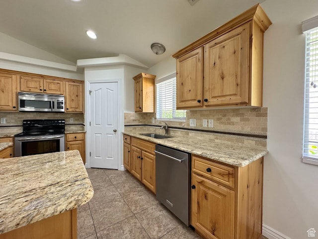 94 Hillsborough Dr, Pleasant View, UT 84414 - kitchen featuring stainless steel appliances, backsplash, vaulted ceiling, light tile patterned flooring, and recessed lighting