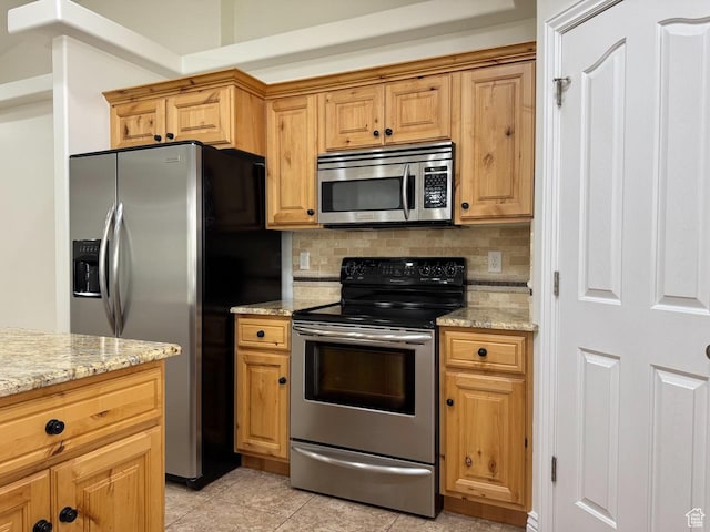 94 Hillsborough Dr, Pleasant View, UT 84414 - kitchen featuring appliances with stainless steel finishes, tasteful backsplash, light stone counters, and light tile patterned floors