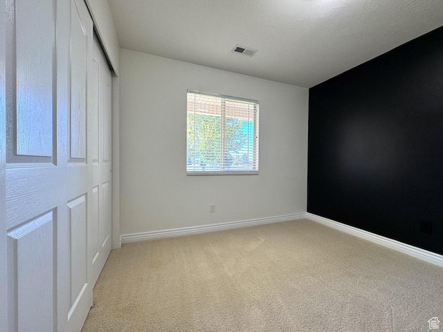 94 Hillsborough Dr, Pleasant View, UT 84414 - unfurnished bedroom with light colored carpet and a closet