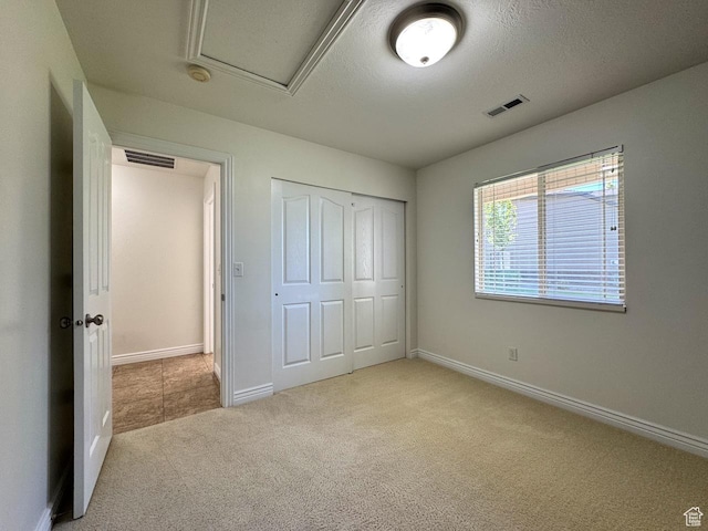 94 Hillsborough Dr, Pleasant View, UT 84414 - unfurnished bedroom featuring carpet floors and a closet
