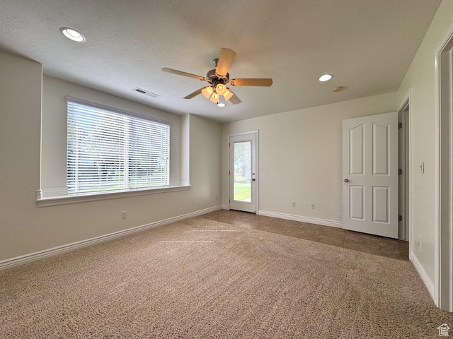 94 Hillsborough Dr, Pleasant View, UT 84414 - spare room featuring carpet floors, a ceiling fan, and recessed lighting