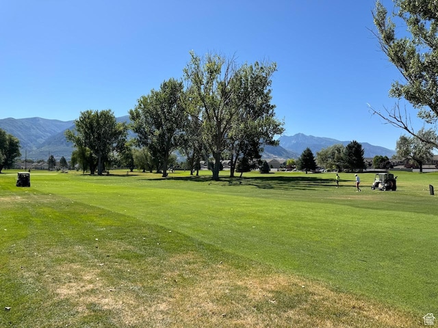 94 Hillsborough Dr, Pleasant View, UT 84414 - view of home's community with a mountain view and a lawn
