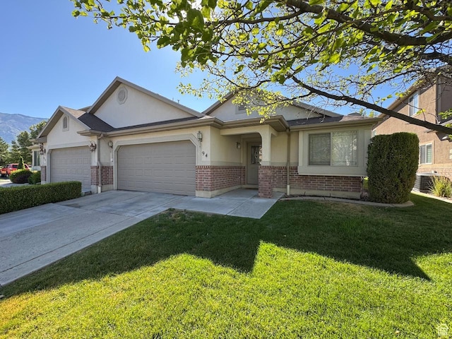 94 Hillsborough Dr, Pleasant View, UT 84414 - ranch-style home featuring brick siding, stucco siding, a garage, and a front lawn